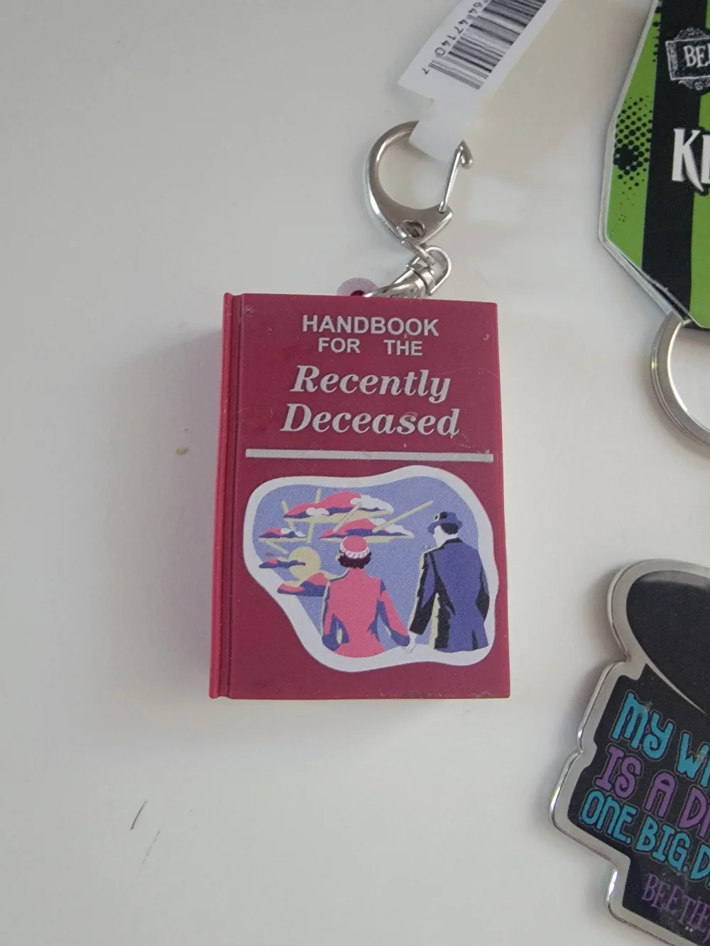 Green & Black Keychain with Red Book Charm